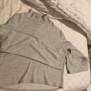 Grey sweater with bell sleeves and turtleneck